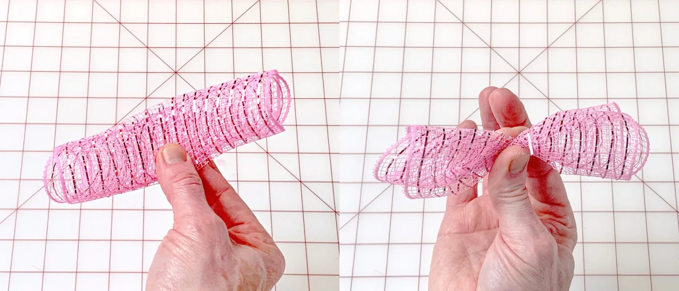 Fingers pinching down a pink deco mesh piece