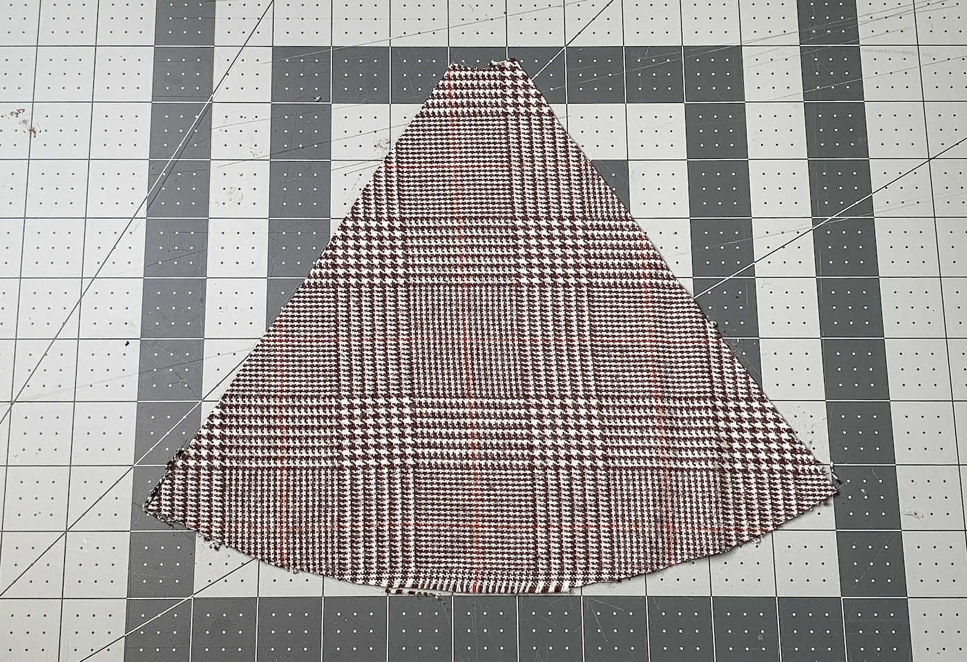 Cut piece of herringbone fabric on a work surface