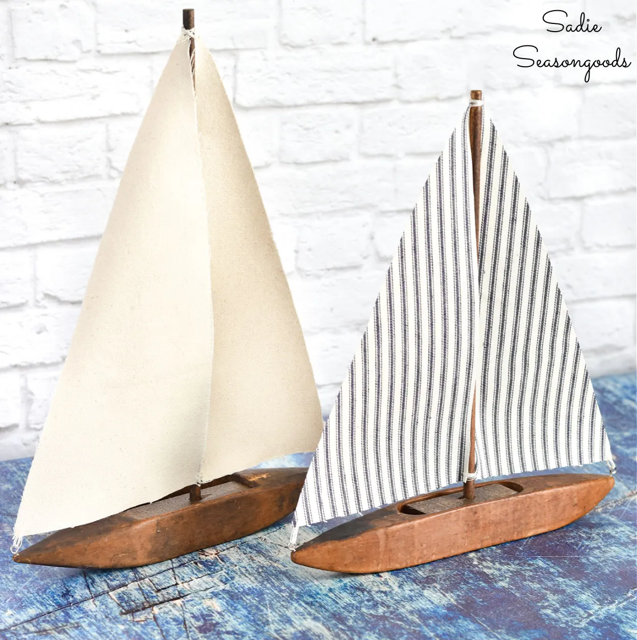 sailboats made using upcycled weaving shuttles