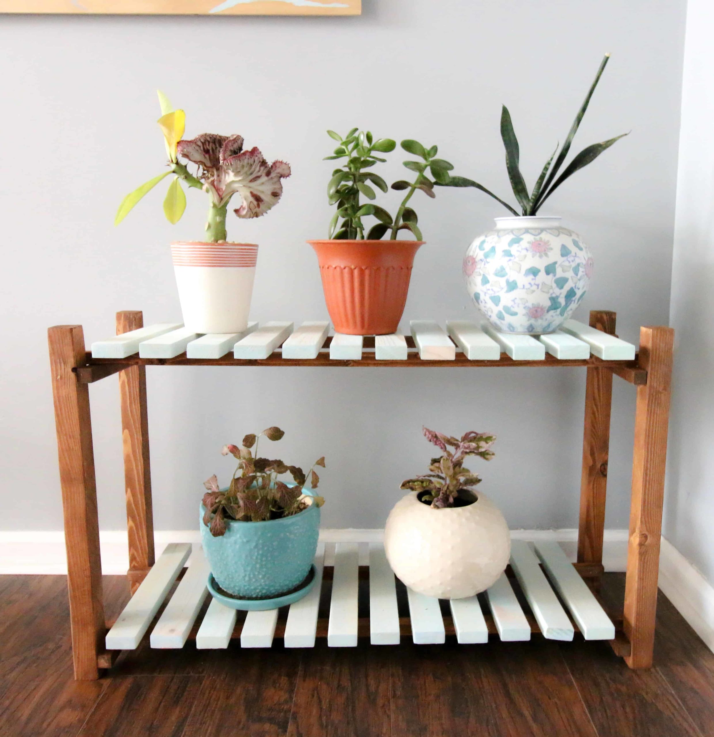 DIY slatted plant stand using scrap wood