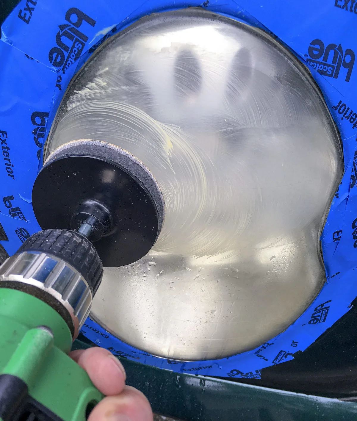 Sanding-a-headlight-with-a-drill-and-sanding-pad
