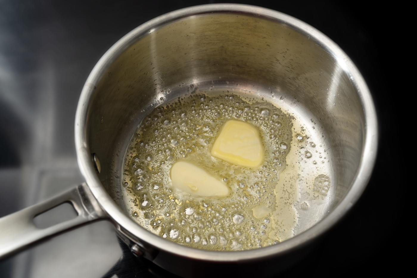 Melting butter in a stainless steel saucepan