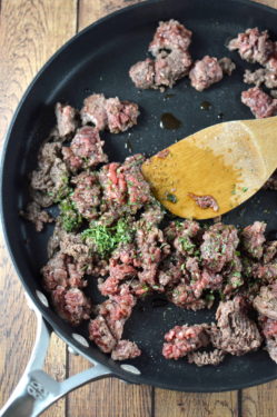Meat cooked on the stove in a pan