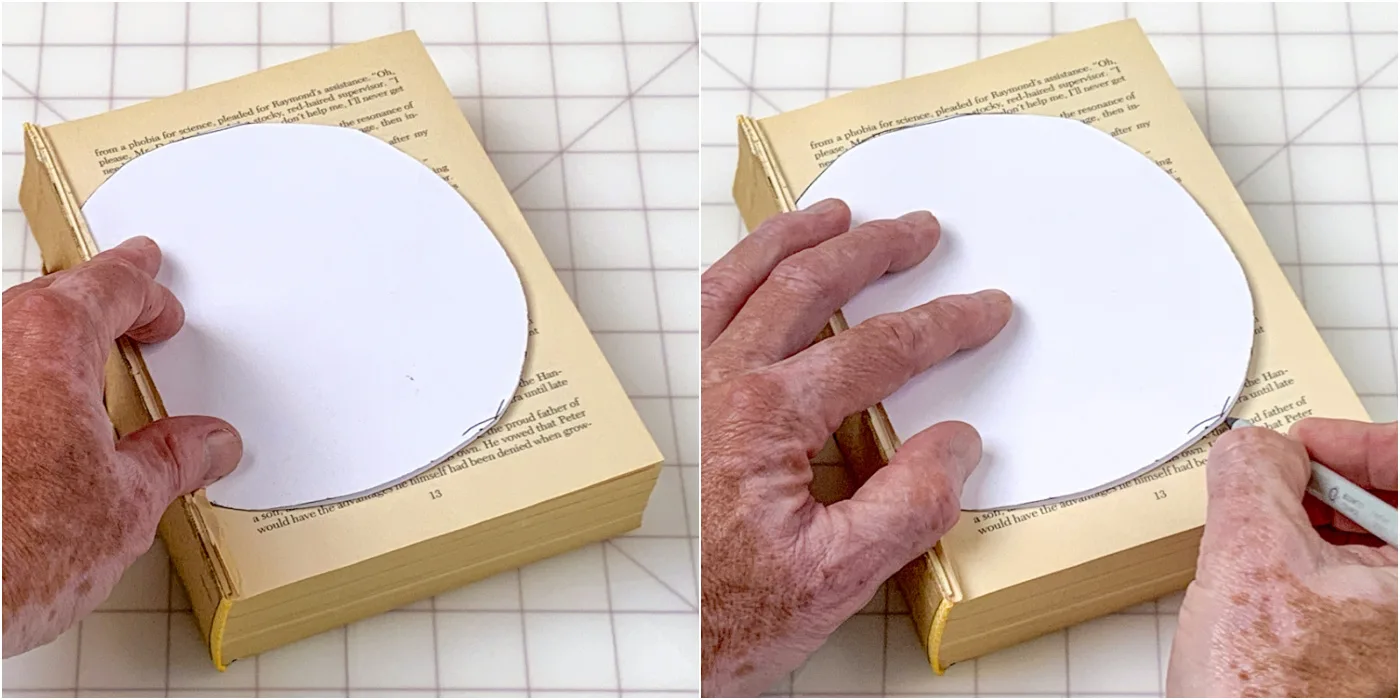 Tracing the template with a pen onto the book pages