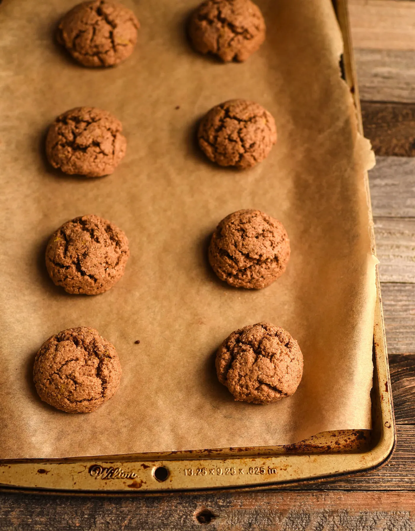baked paleo almond butter cookies on a cookie sheet