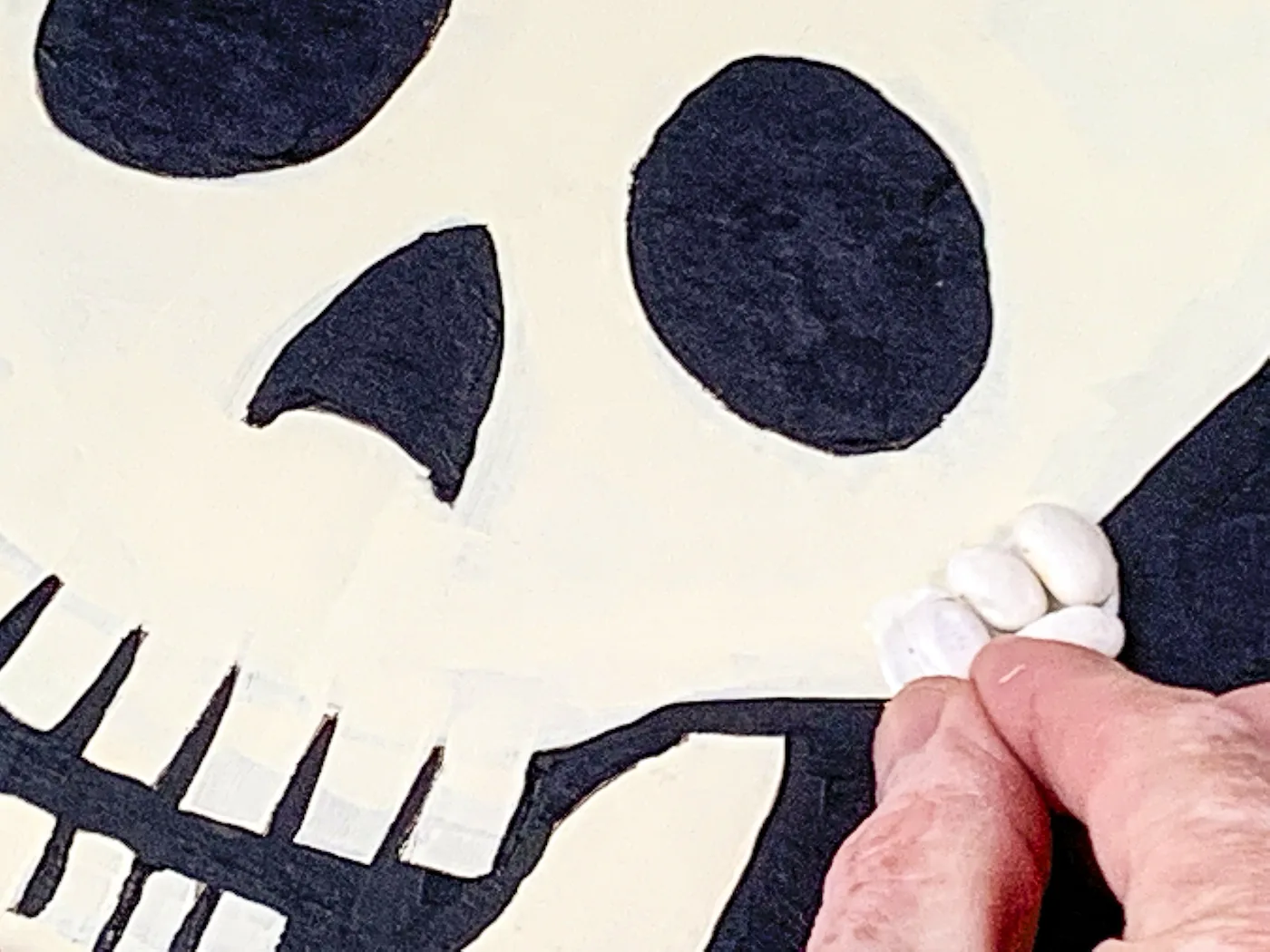 Adding beans to the skull with glue