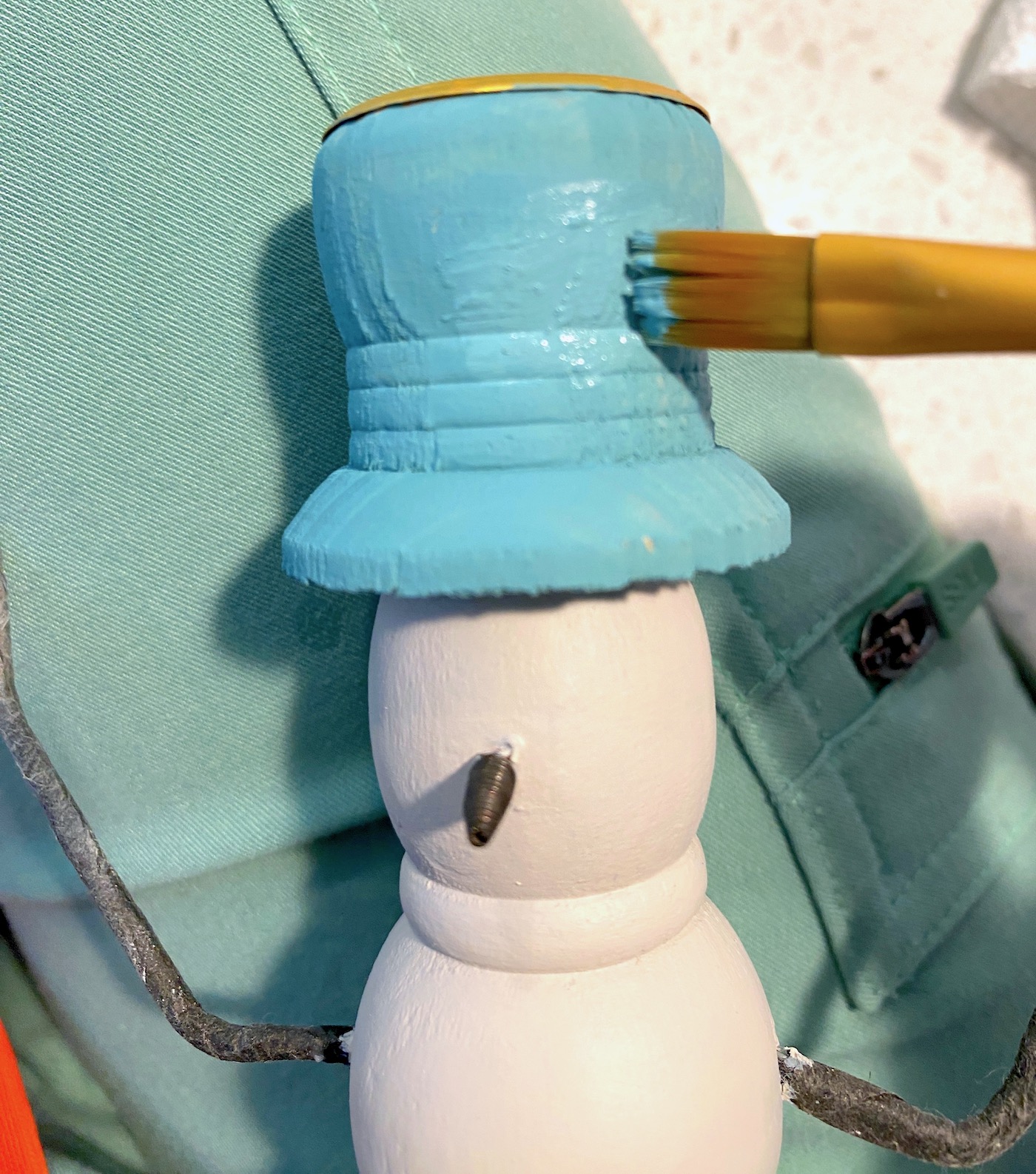 Painting the hat with chalk paint