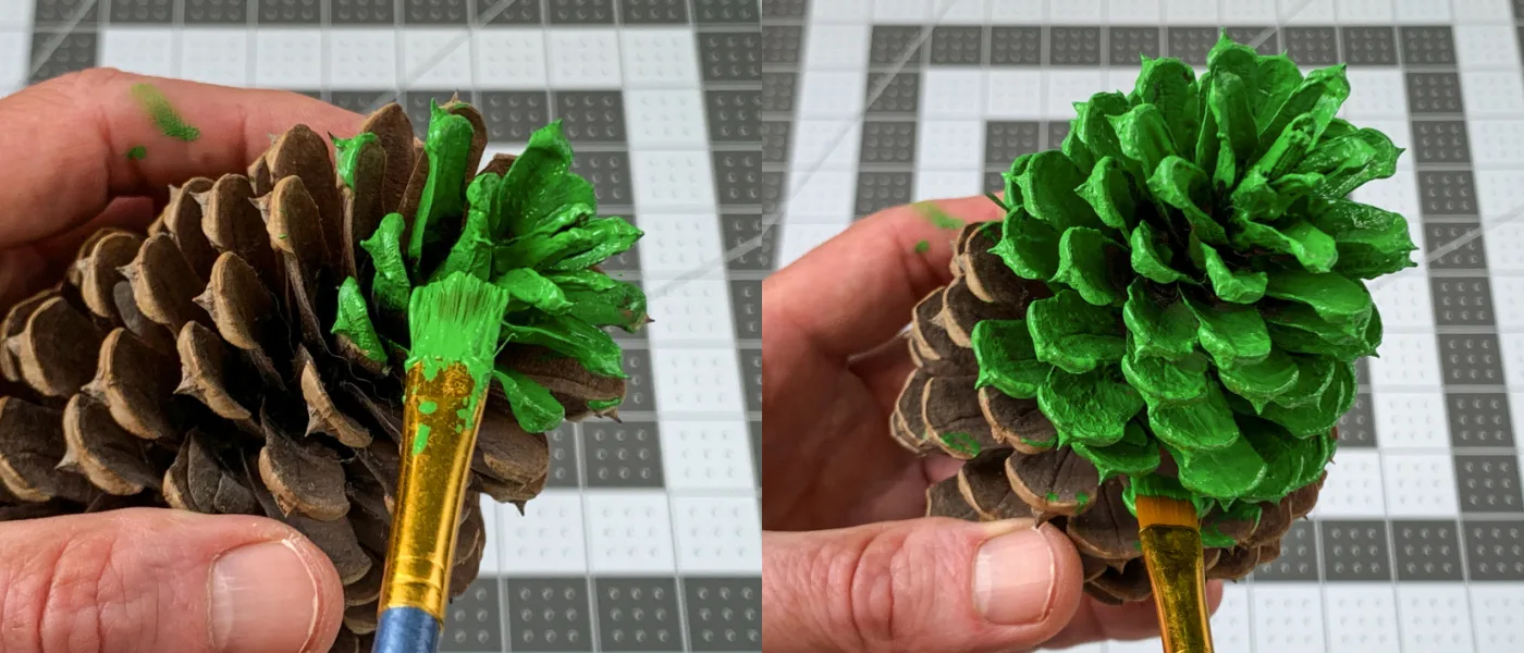 Painting the pine cone with green craft paint