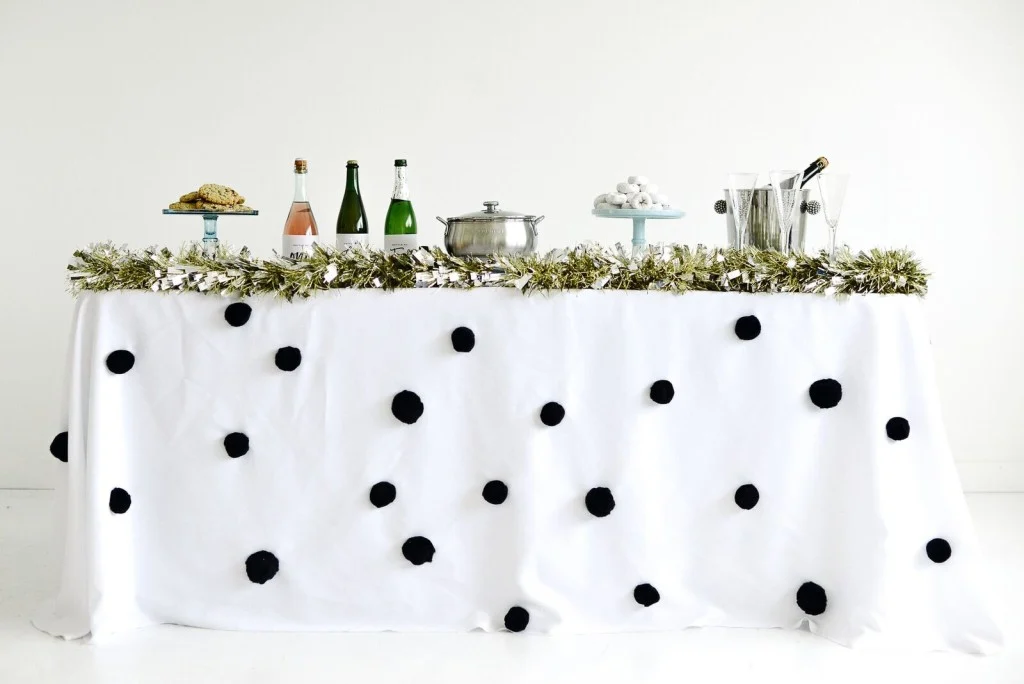 diy pom pom tablecloth for a new year party