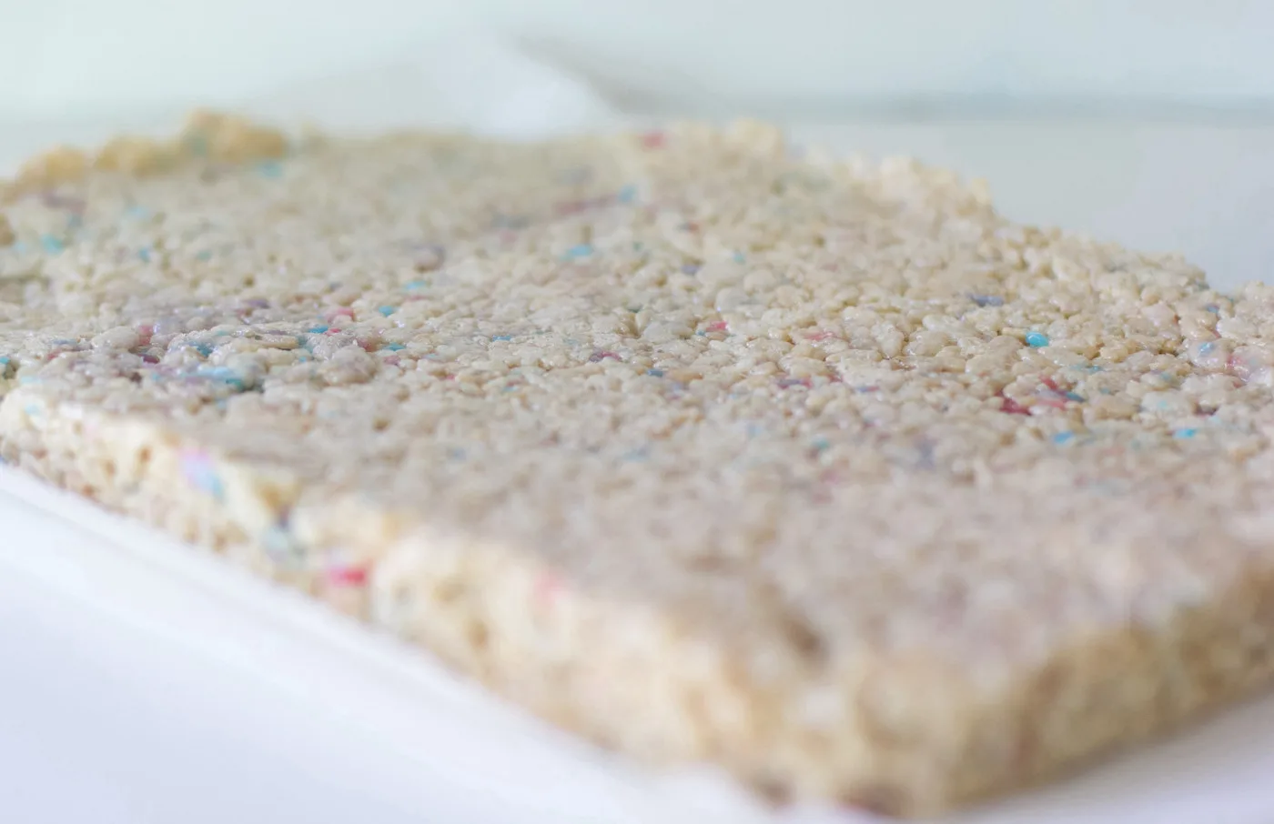 Rice krispies after being pressed into a pan