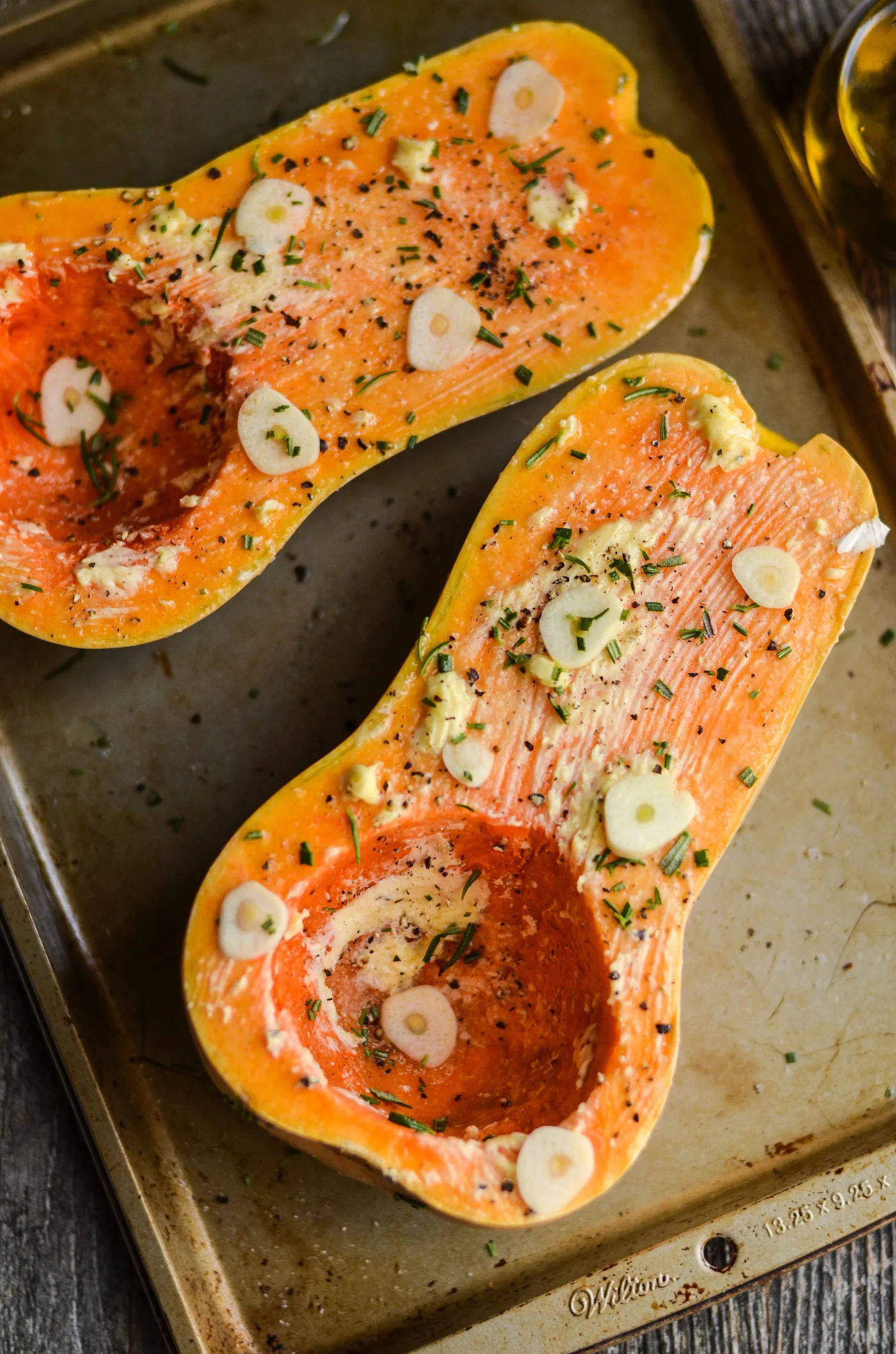 Squash with butter, rosemary, and garlic on top