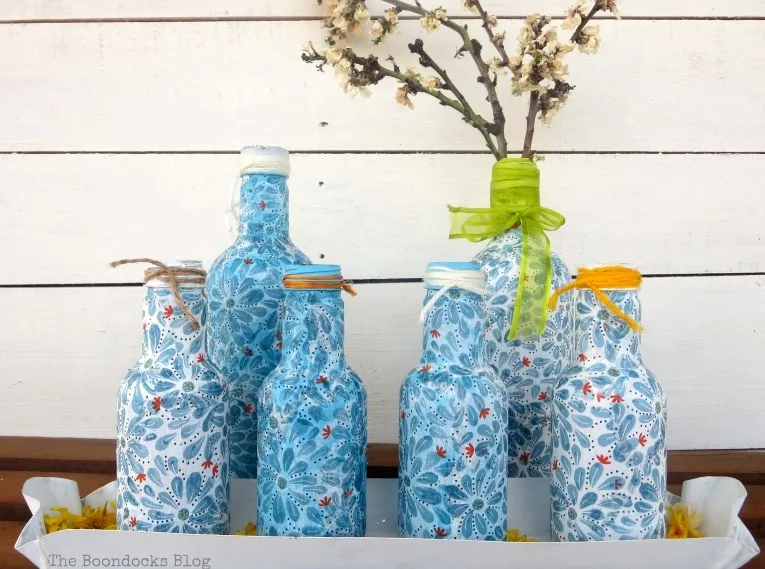 decoupaged napkin plastic ice tea bottles