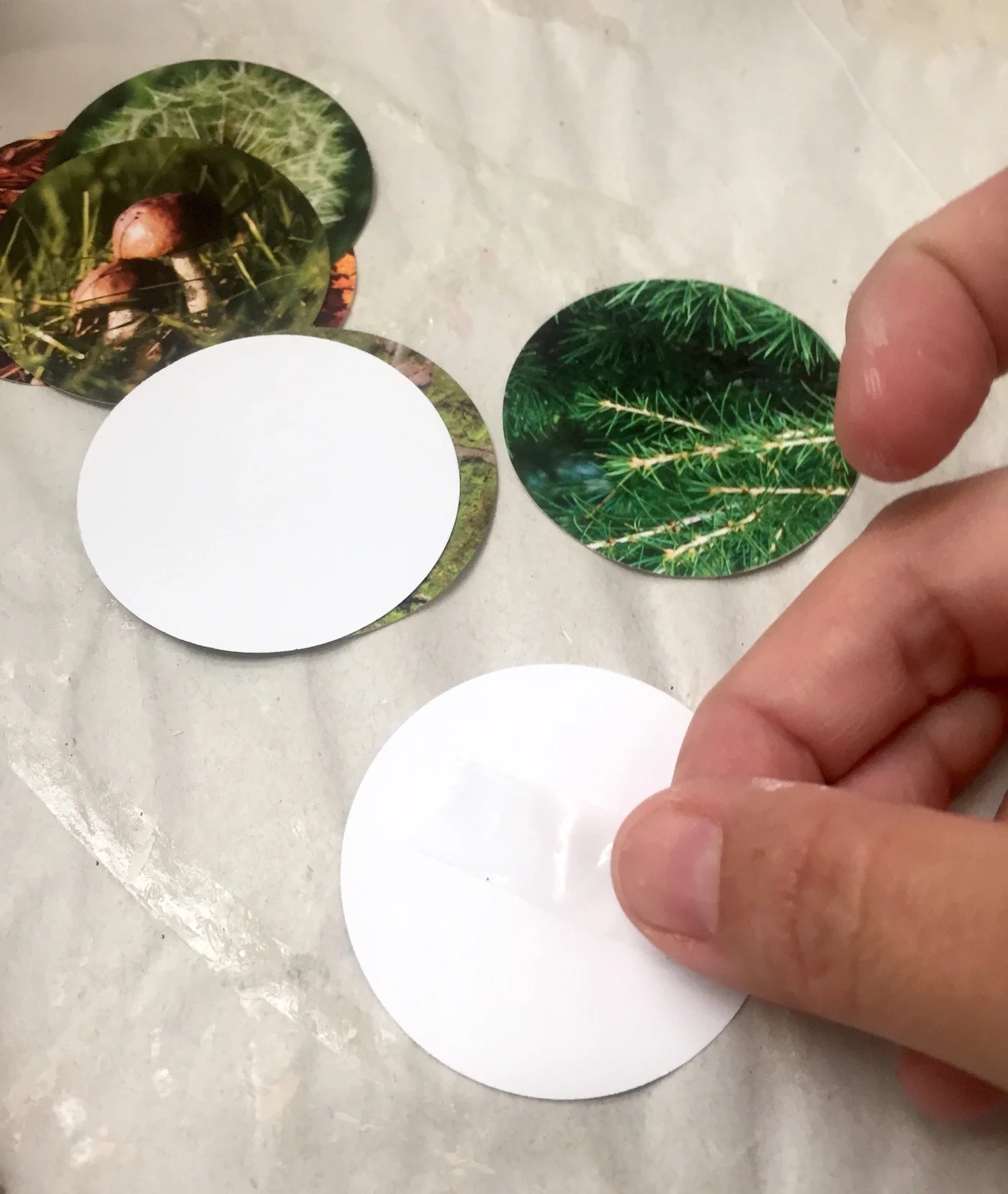 Putting tape on the back of paper circles