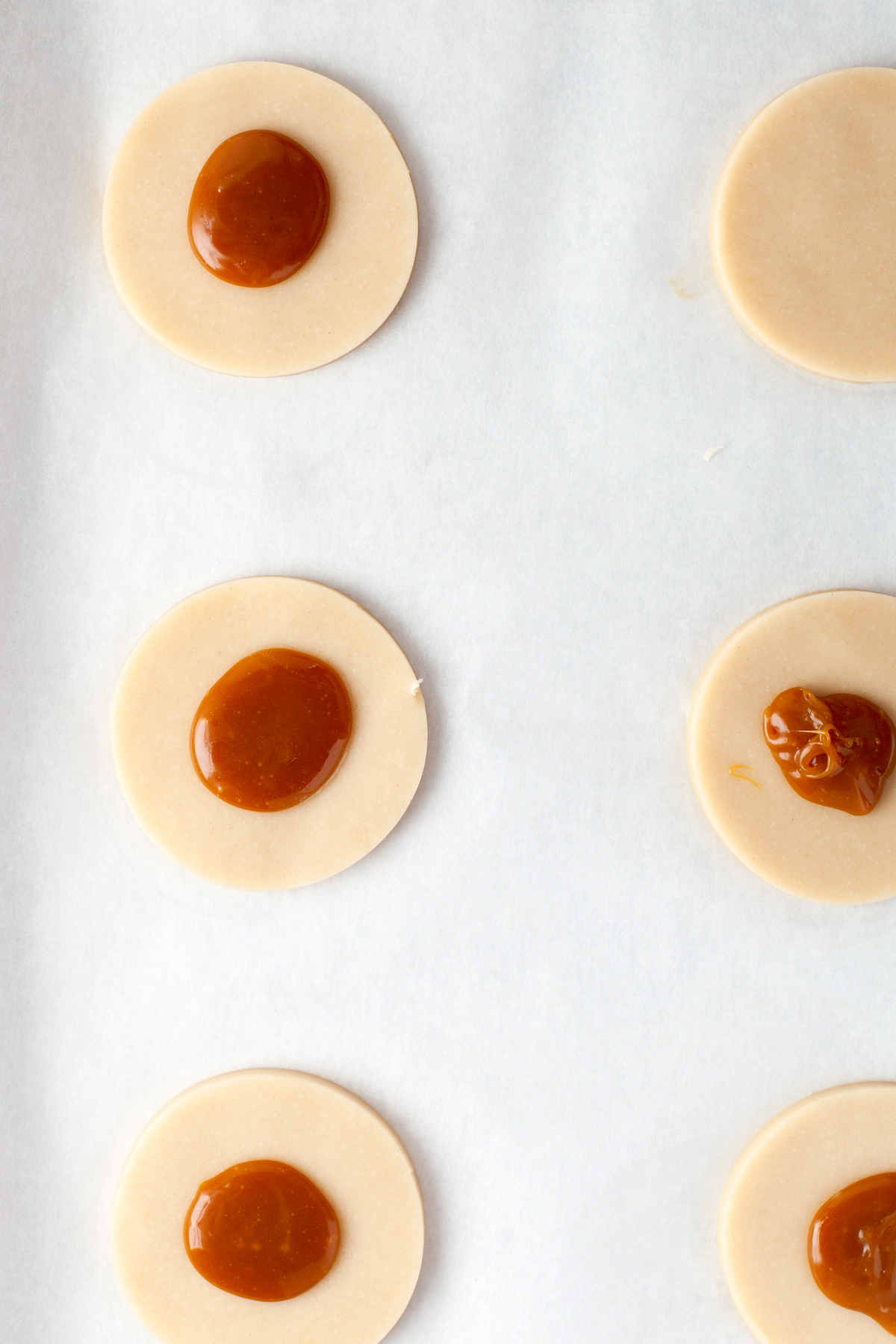 Add caramel to the center of the dough