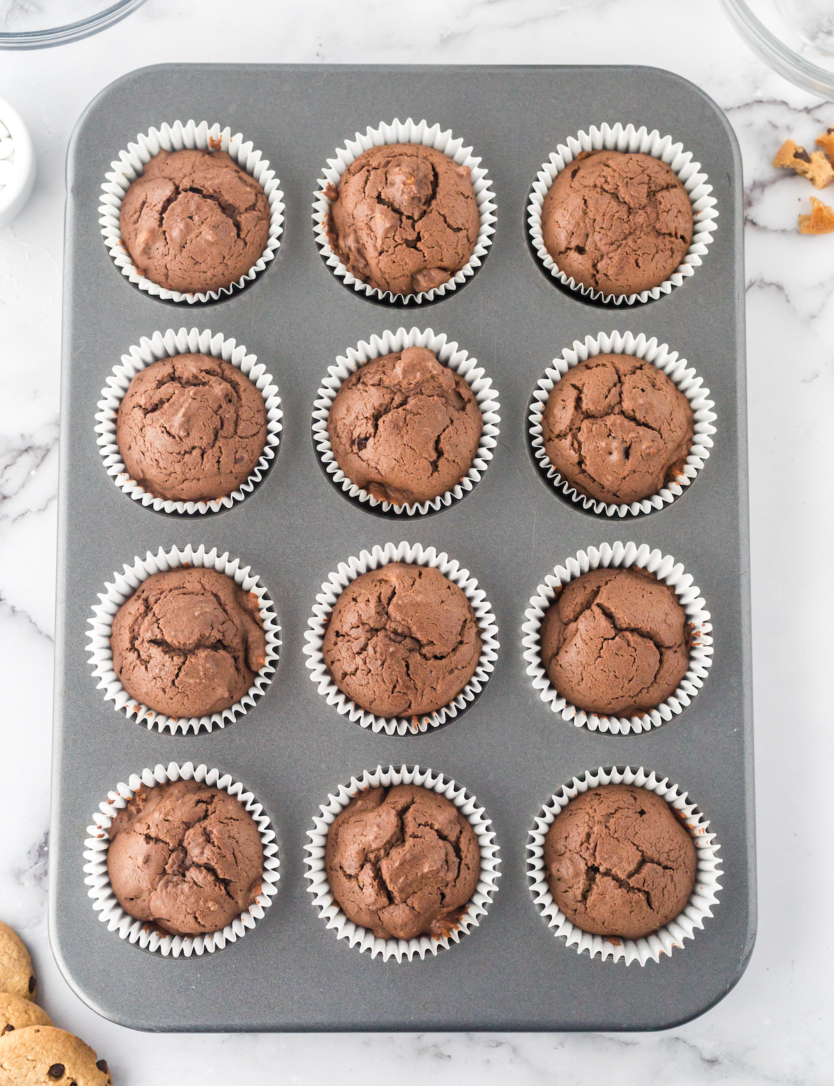 Baked chocolate cupcakes in a cupcake pan