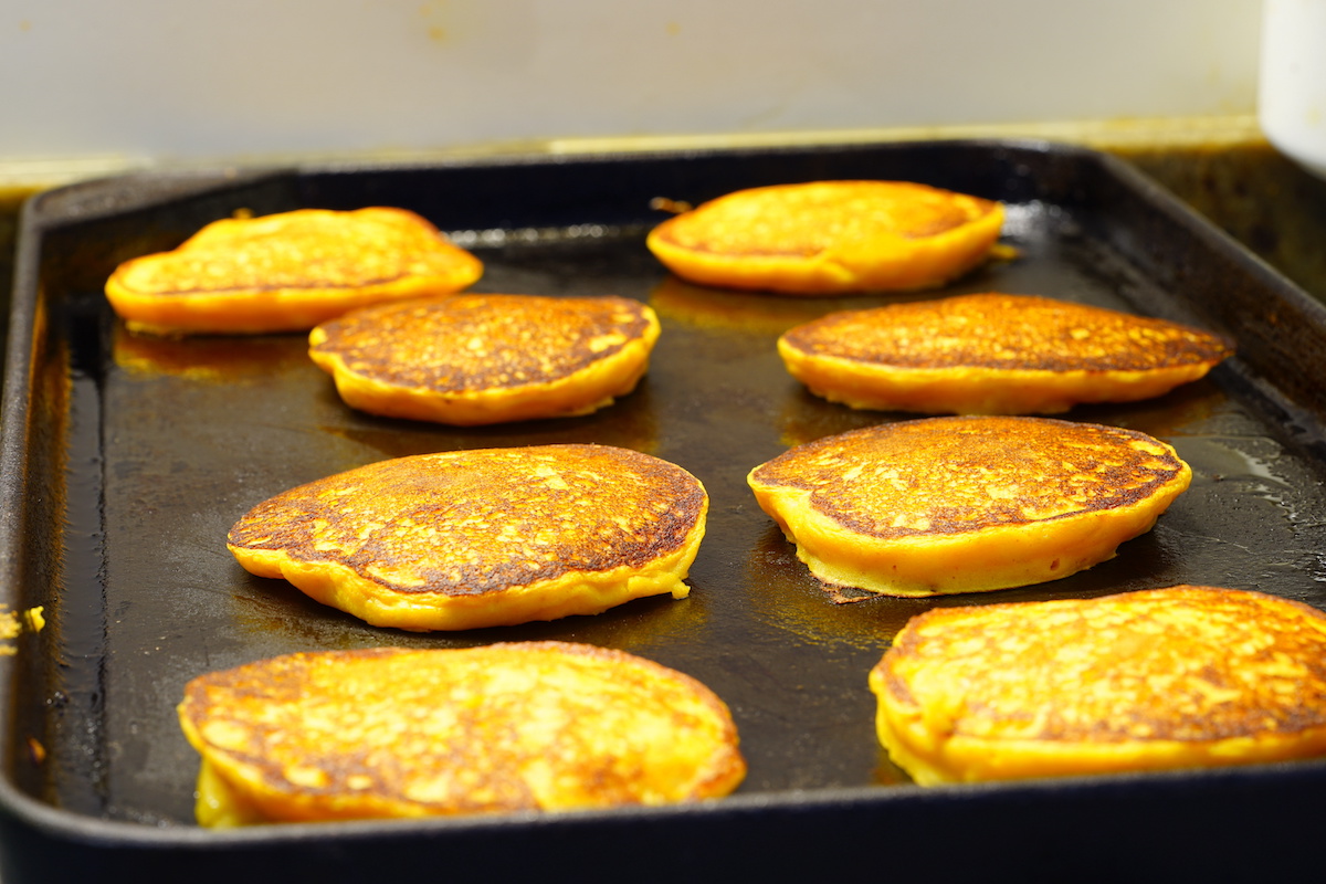 Pumpkin-pancakes-flipped-over-on-a-griddle