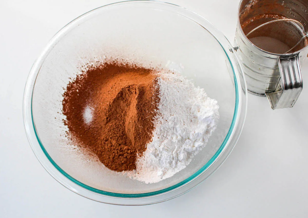 Sift together the cocoa, powdered sugar, and salt