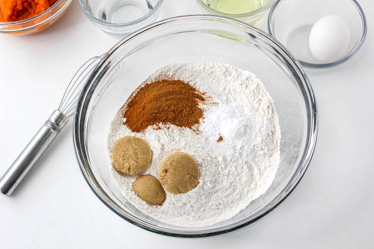 Whisking together flour, sugars, cinnamon, and pumpkin pie spice