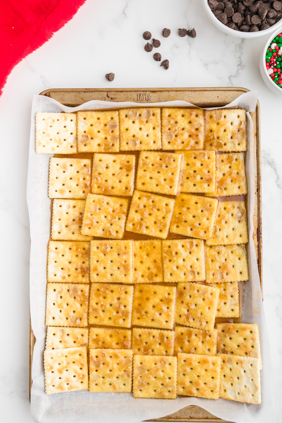 Butter and brown sugar mixture poured over the saltine crackers