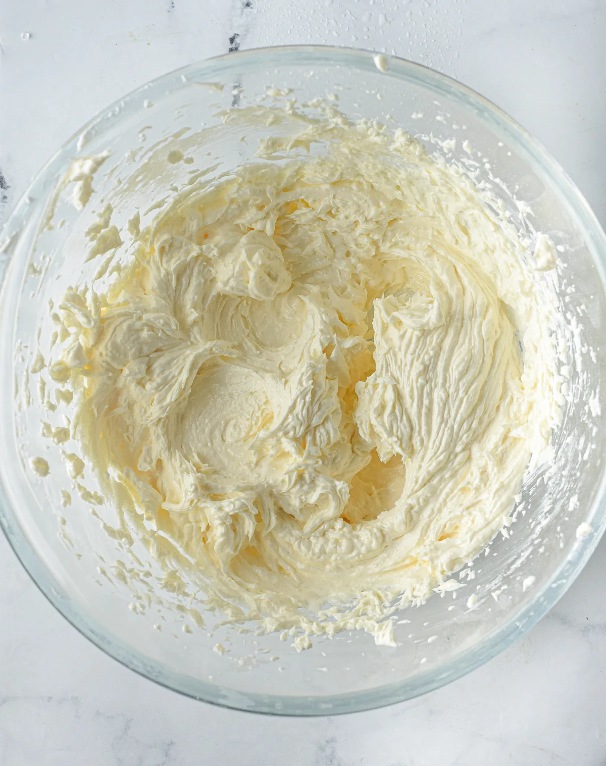 Butter beat with a hand mixer in a glass bowl until creamy