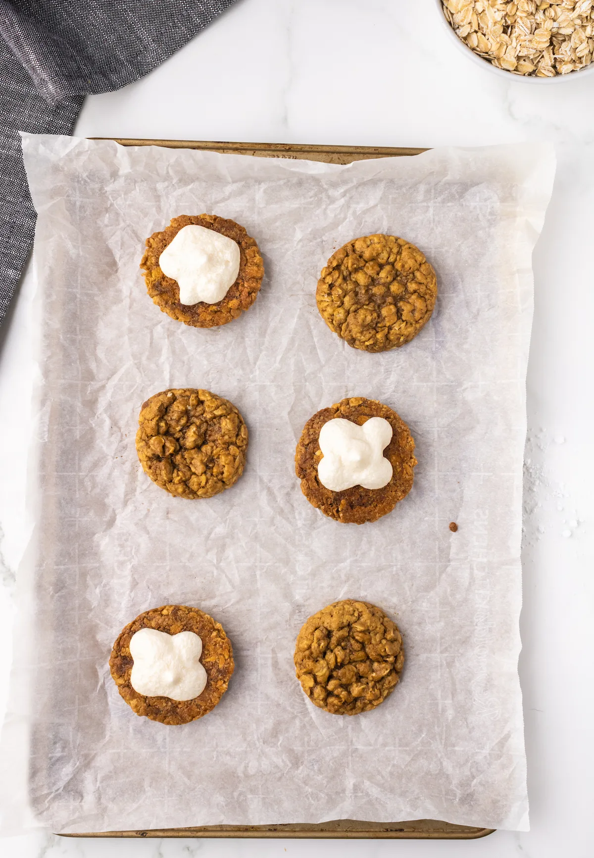 Cream filling on top of the oatmeal cookies