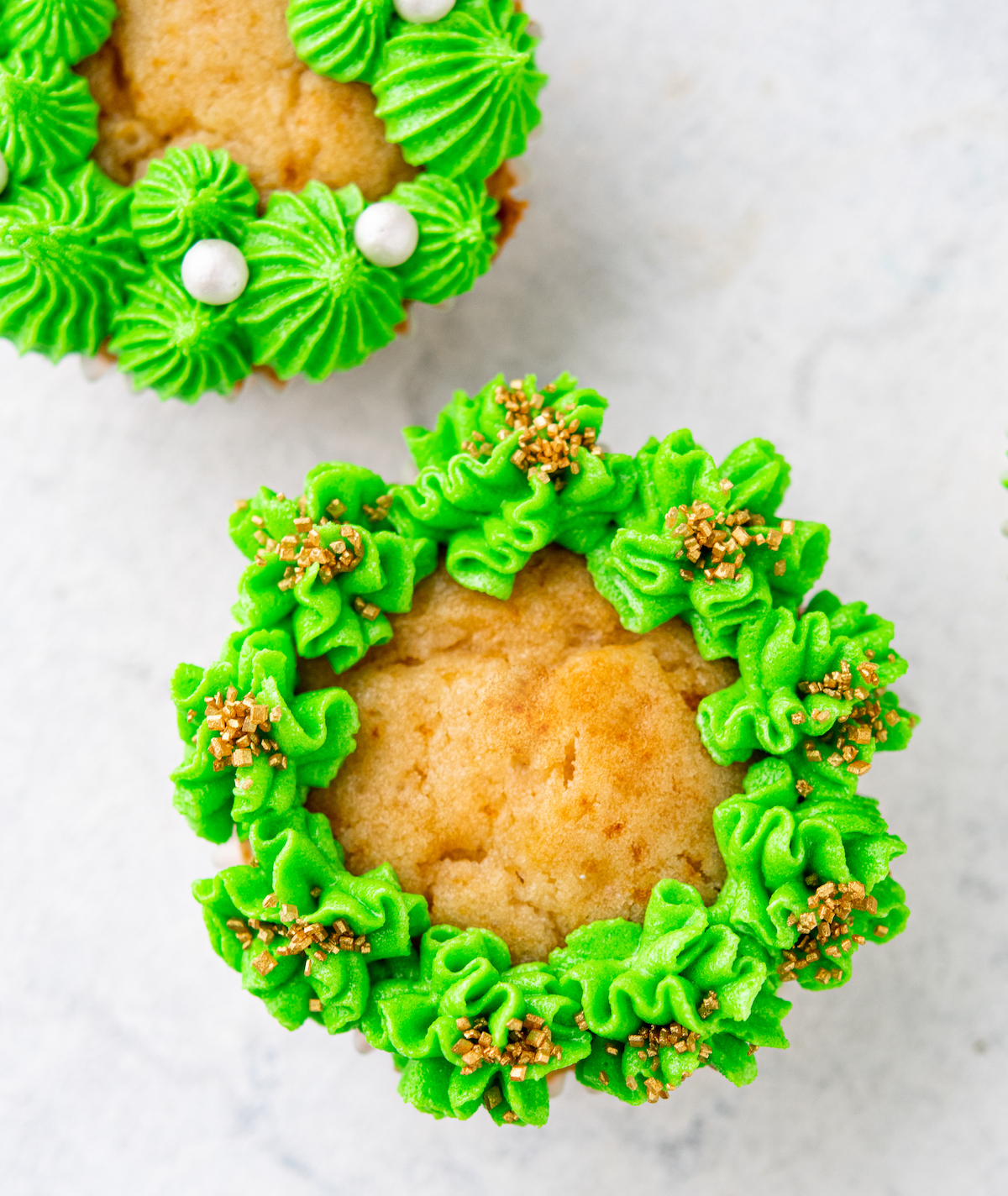 Iced cupcakes with a Christmas wreath design
