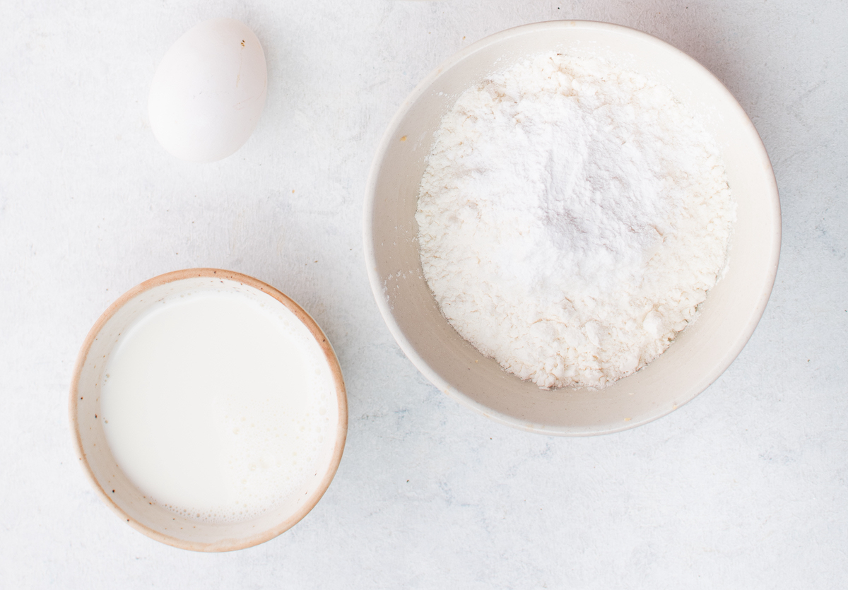 Milk, egg, and dry ingredients in a bowl