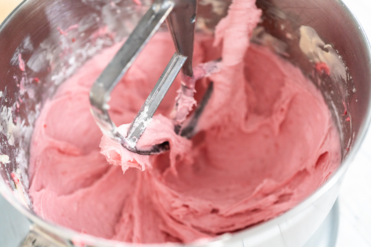 Pink-strawberry-frosting-in-a-stand-mixer-bowl