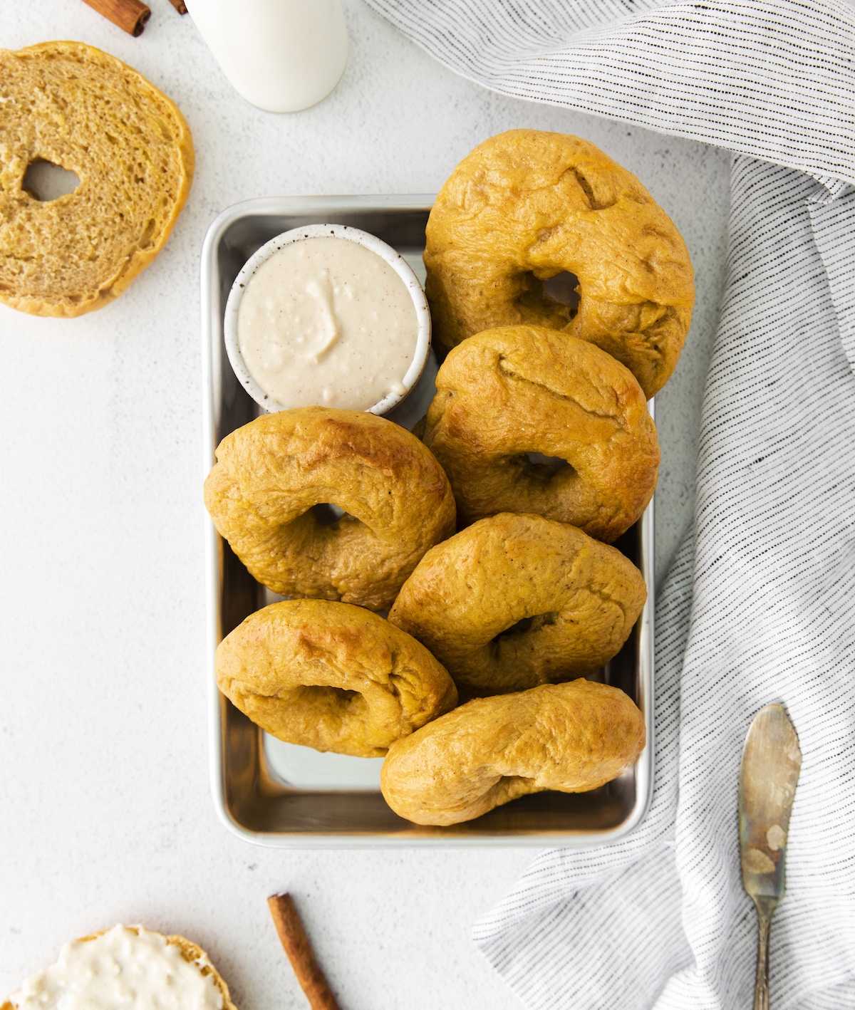 Plate of pumpkin bagels with maple flavored cream cheese