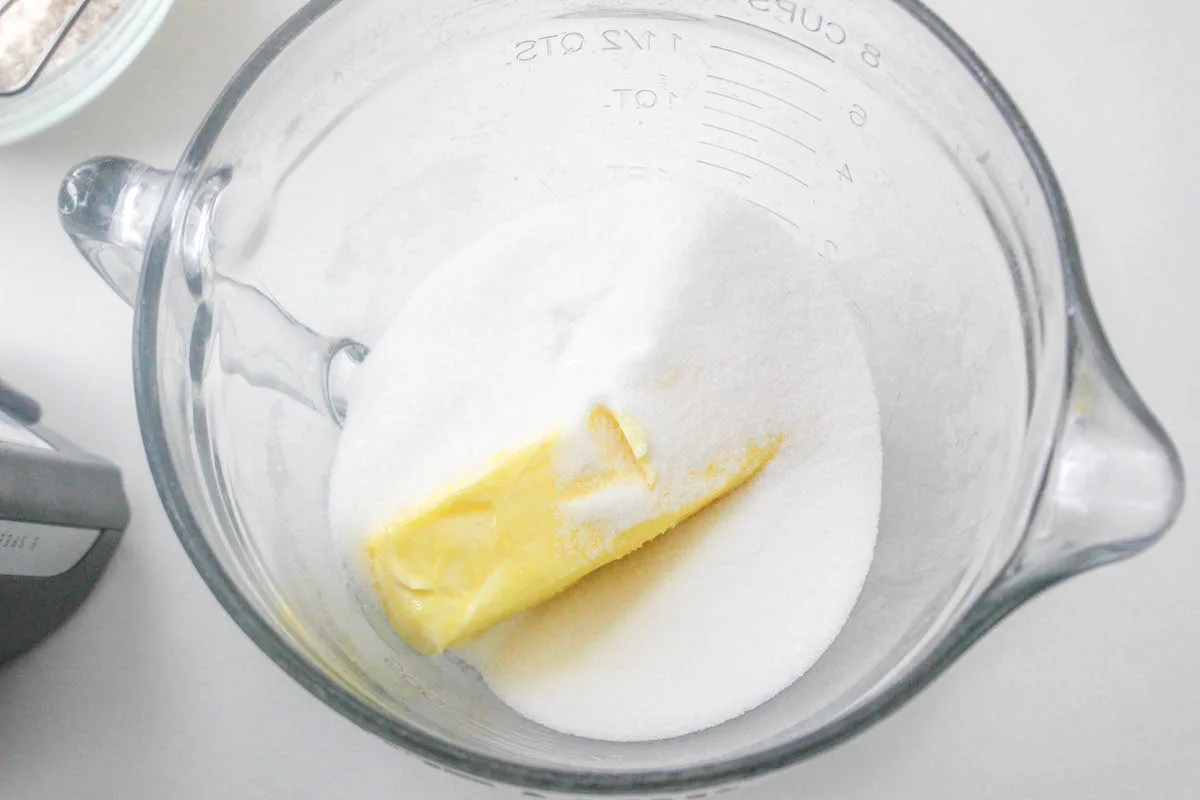 butter and sugar together in a glass measuring cup