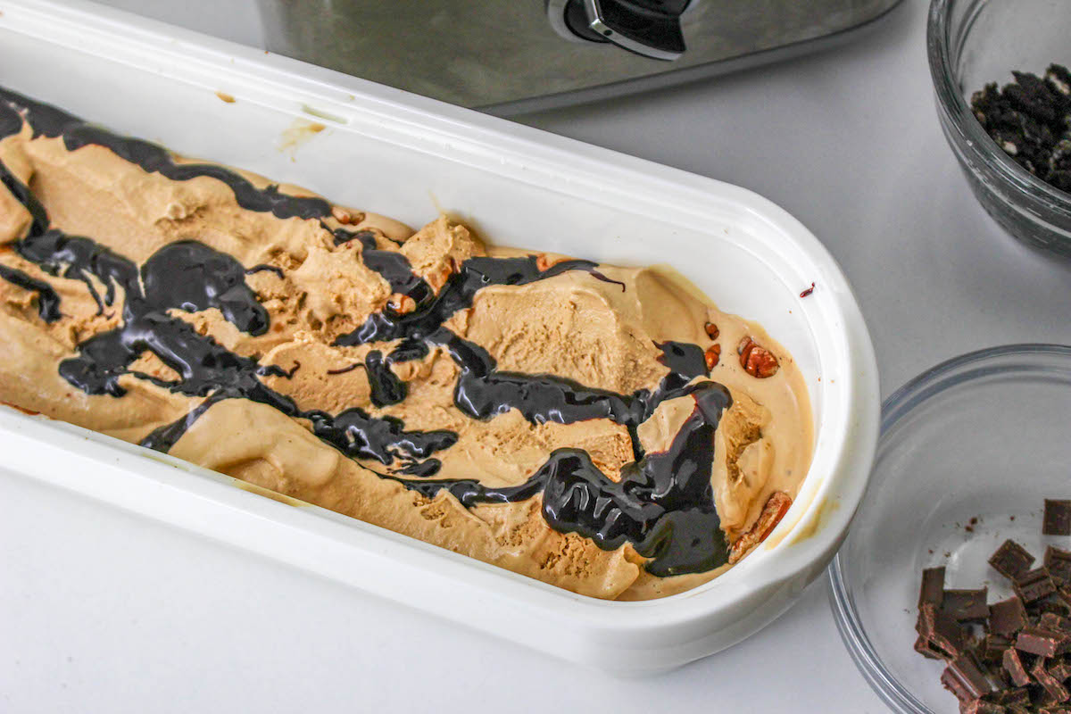 ice cream and fudge layered in a freezer container