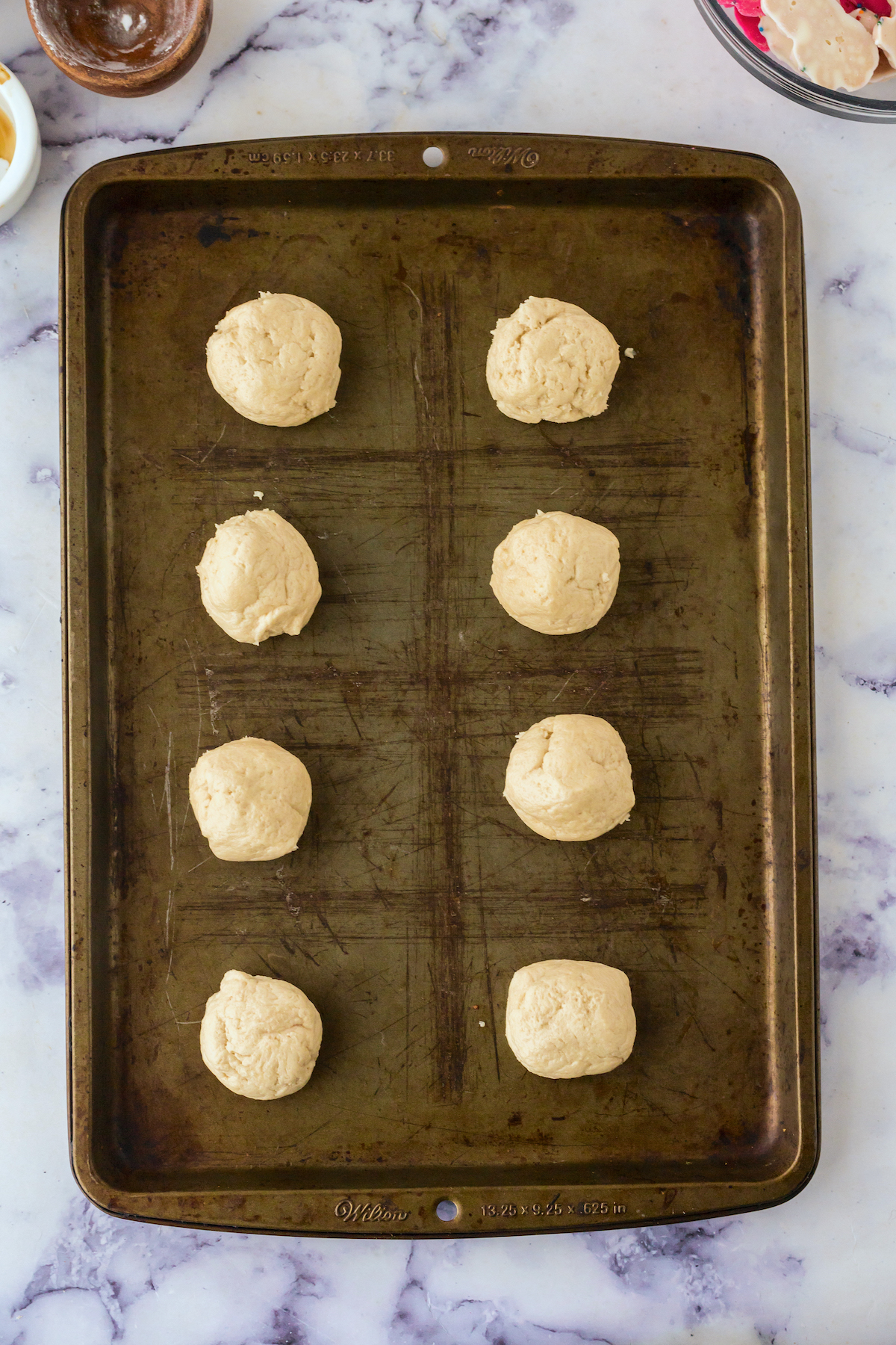 sugar cookie dough placed on the baking sheet