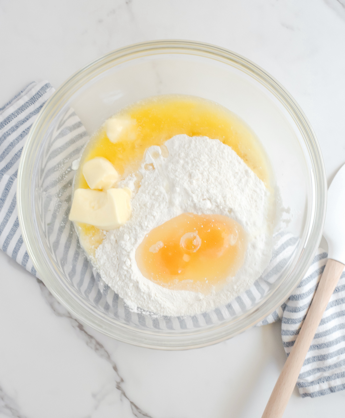 Cake mix, butter, and eggs combined in a bowl