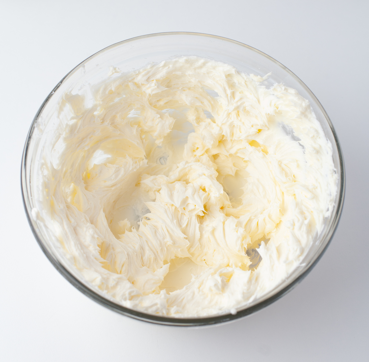 Cream cheese and butter whipped together in a bowl