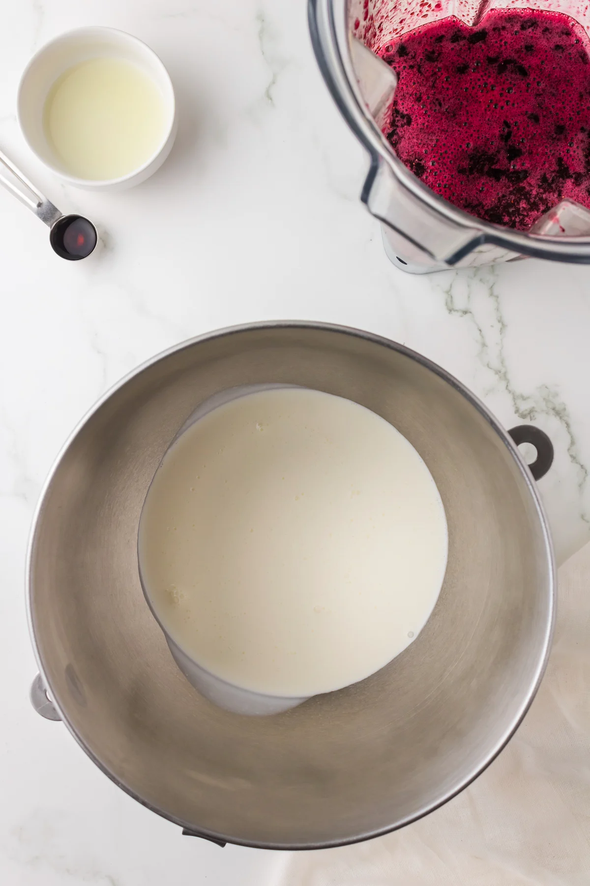 Heavy cream in a metal bowl