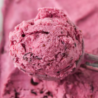 Taking a scoop of blueberry ice cream