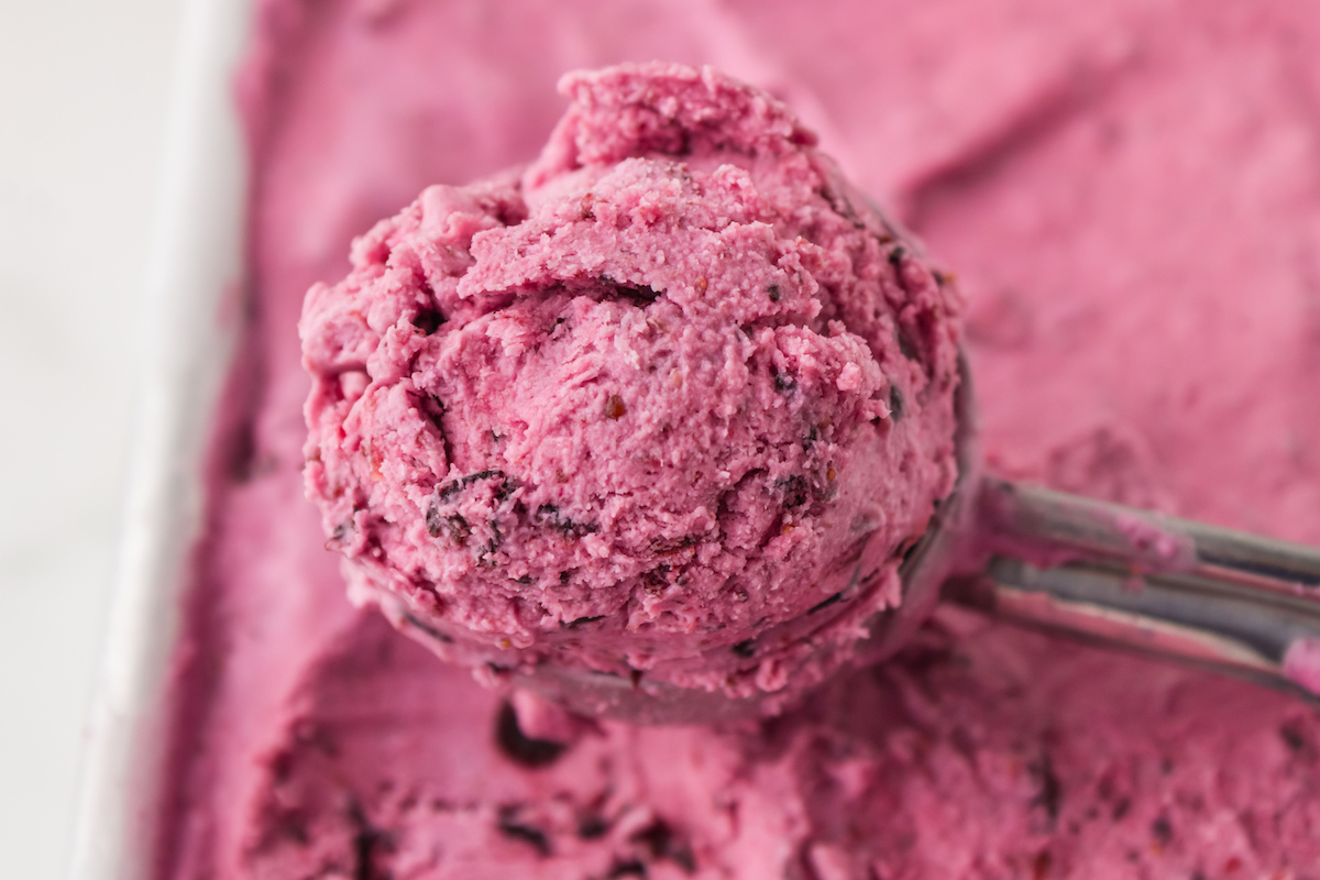 Taking a scoop of blueberry ice cream