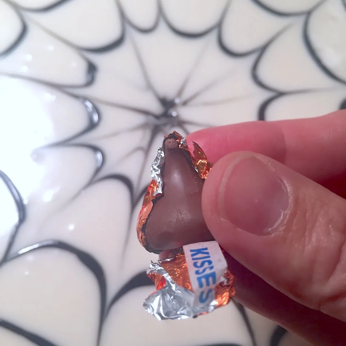Unwrapping a Hershey's kiss