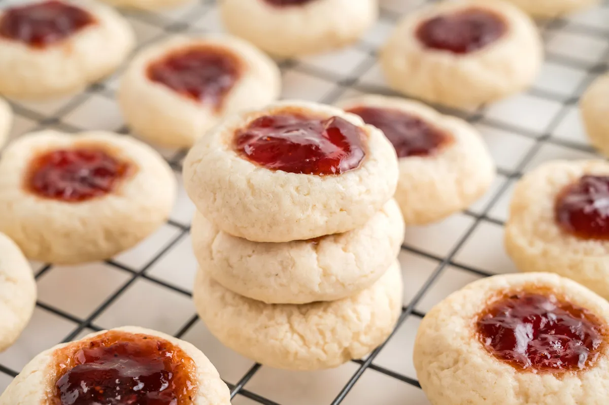 stack of thumb cookies with jam