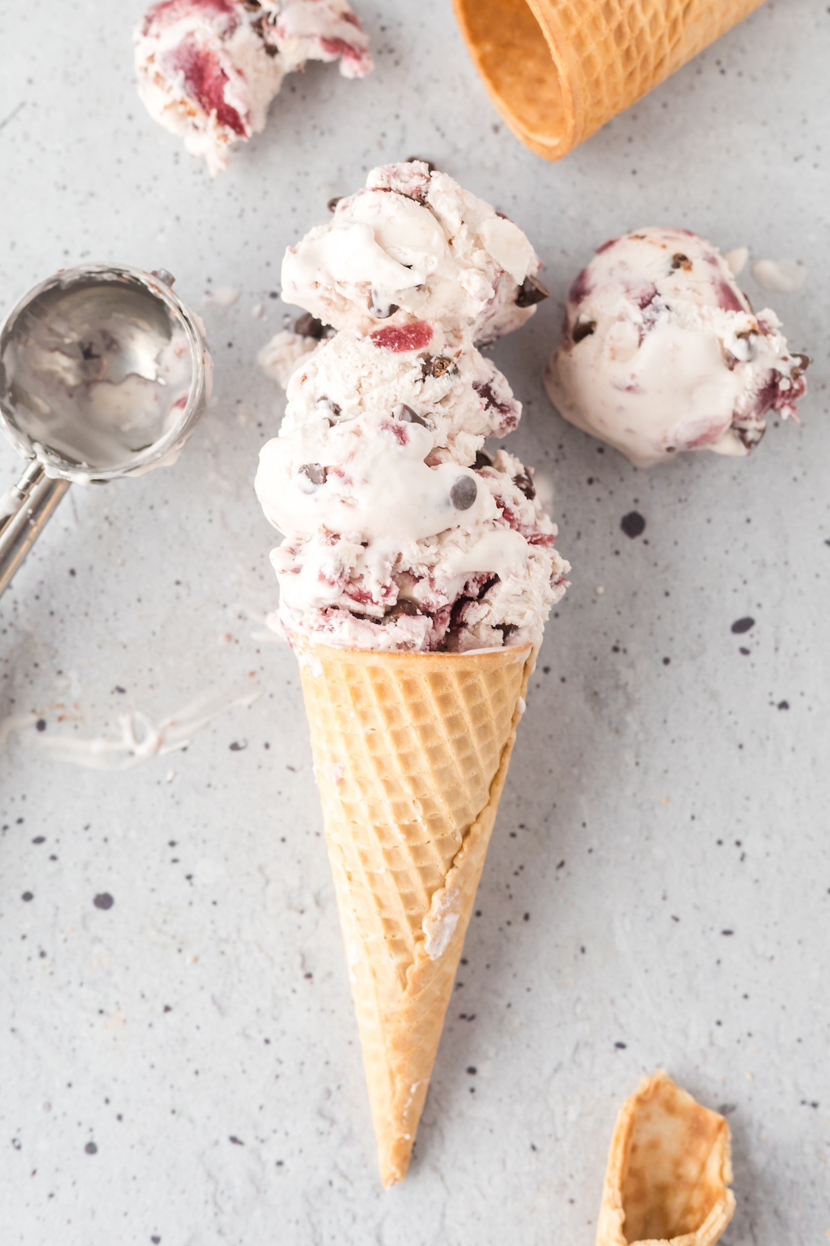 chocolate cherry ice cream in a cone