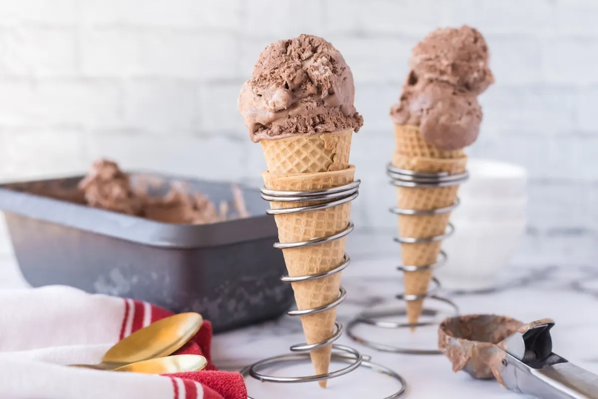 ice cream with caramel and chocolate in cones