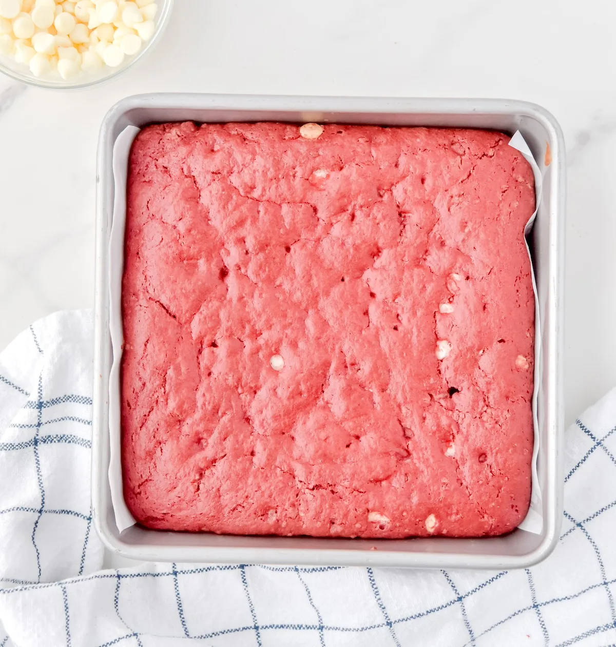 Red velvet brownies with white chocolate chips baked in a pan