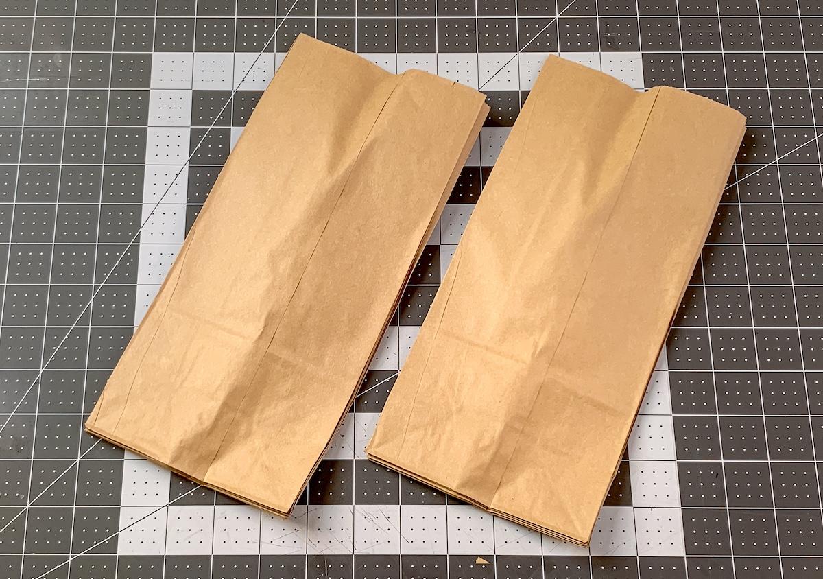 Two stacks of brown paper lunch bags glued together