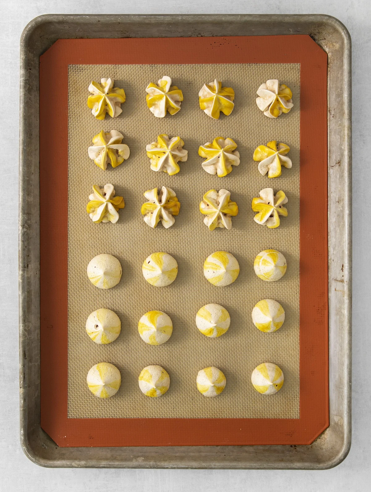 baked meringue cookies on a silpat