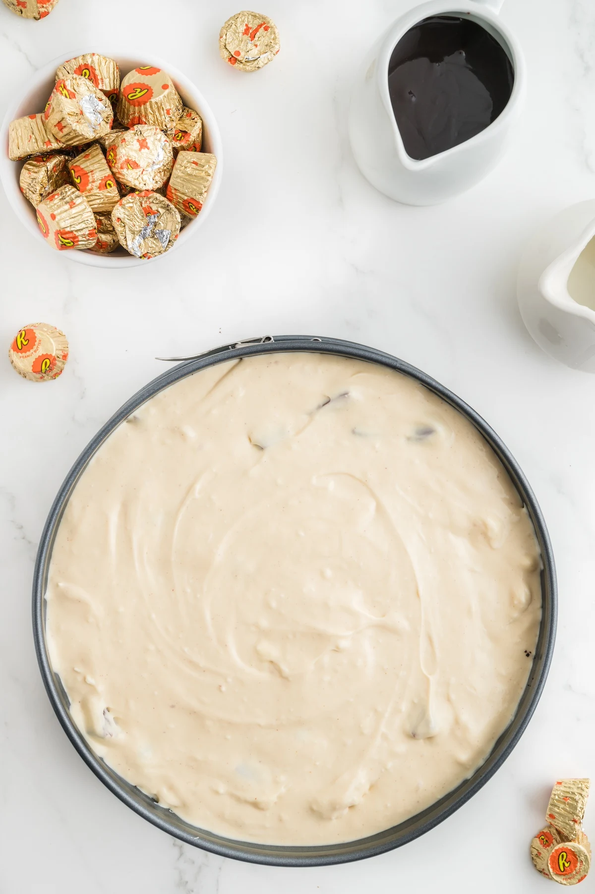 cheesecake batter in a springform pan ready to bake