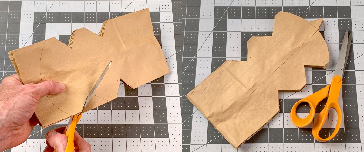 cutting the design out of the paper bags using scissors