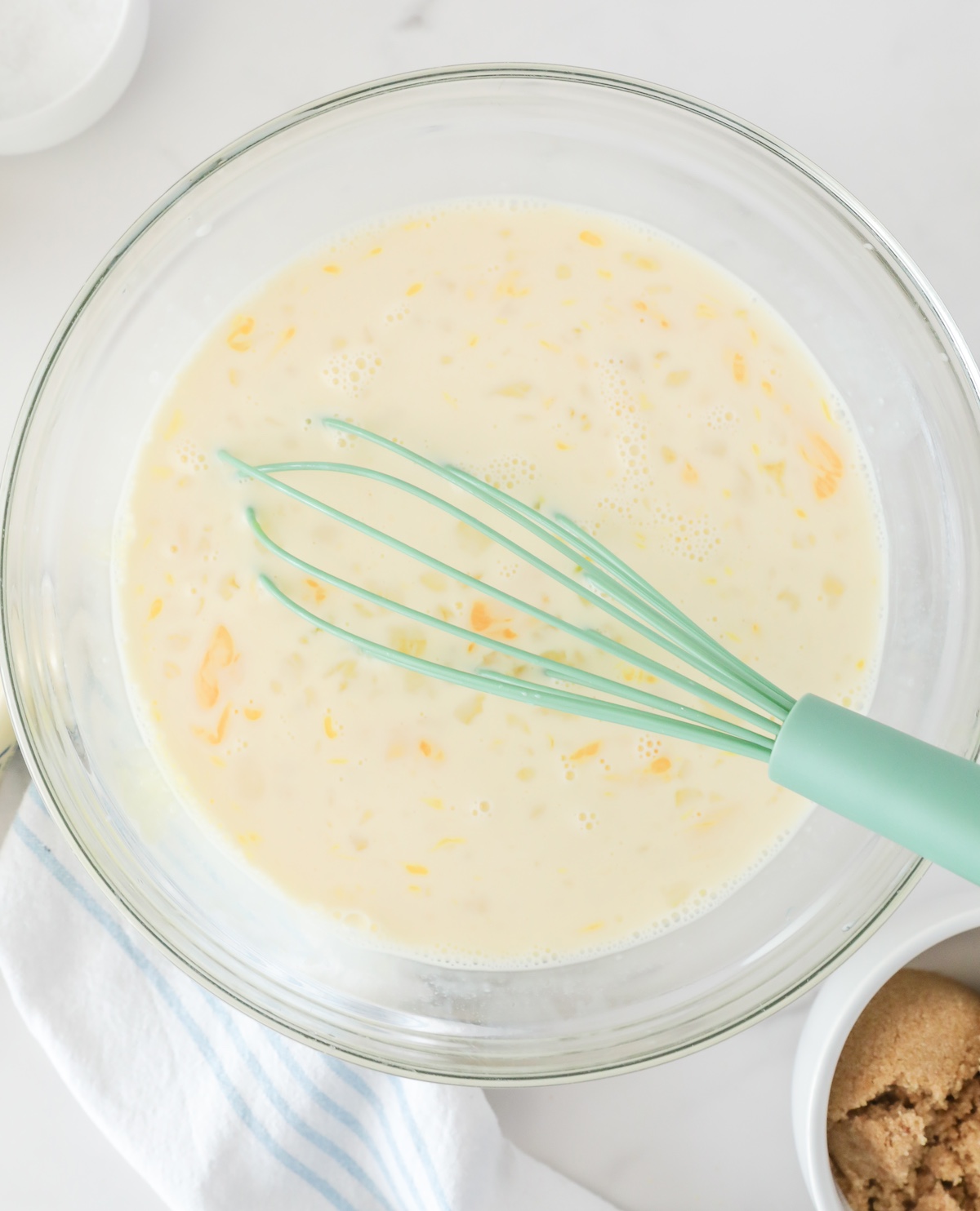 mix eggs, milk, half and half, vanilla extract, and sugar in a bowl