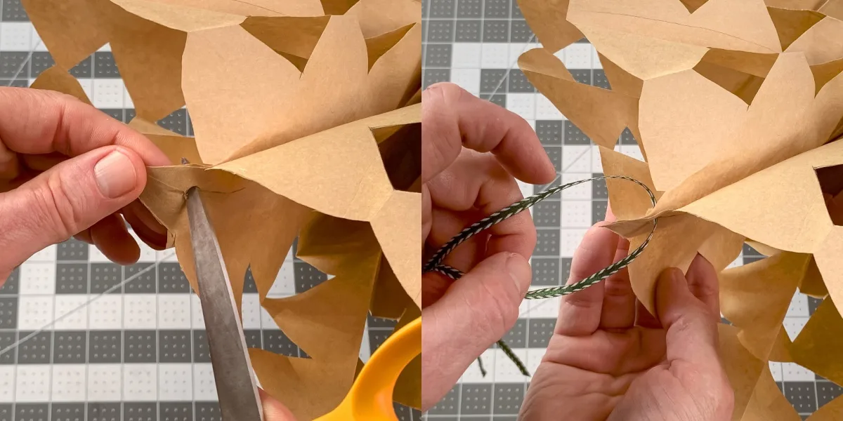punching a hole in the top of the snowflake and adding ribbon