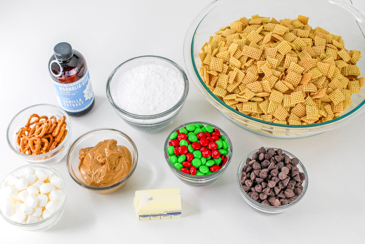 Chex cereal, vanilla, powdered sugar, peanut butter, chocolate chips, M&Ms, pretzels, mini marshmallows