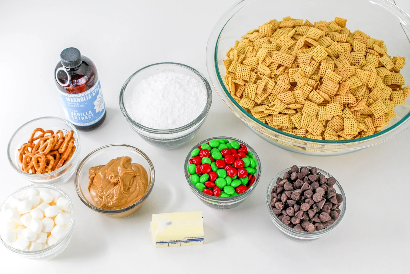 Chex cereal, vanilla, powdered sugar, peanut butter, chocolate chips, M&Ms, pretzels, mini marshmallows